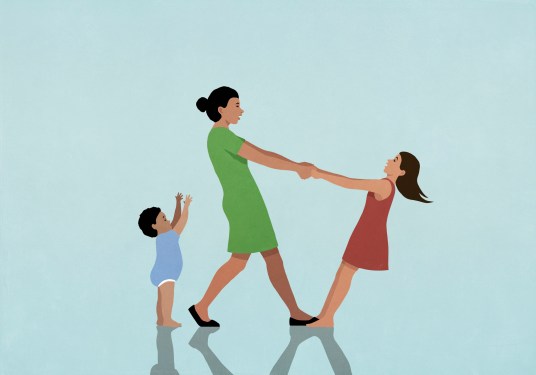 Happy, carefree mother playing with daughter and baby son