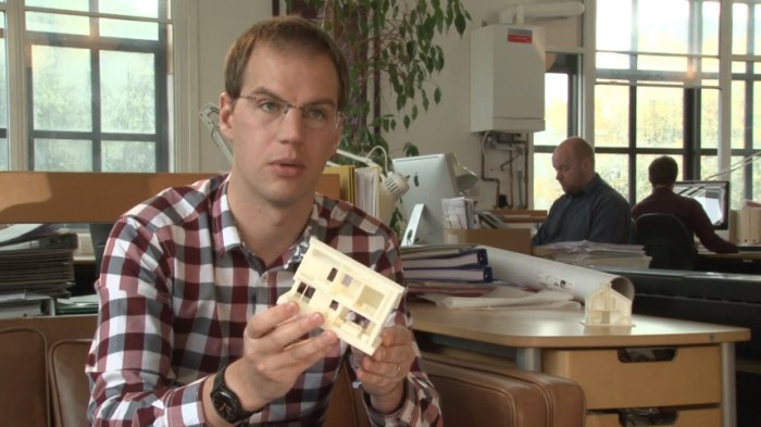 Man explaining a design on his hand